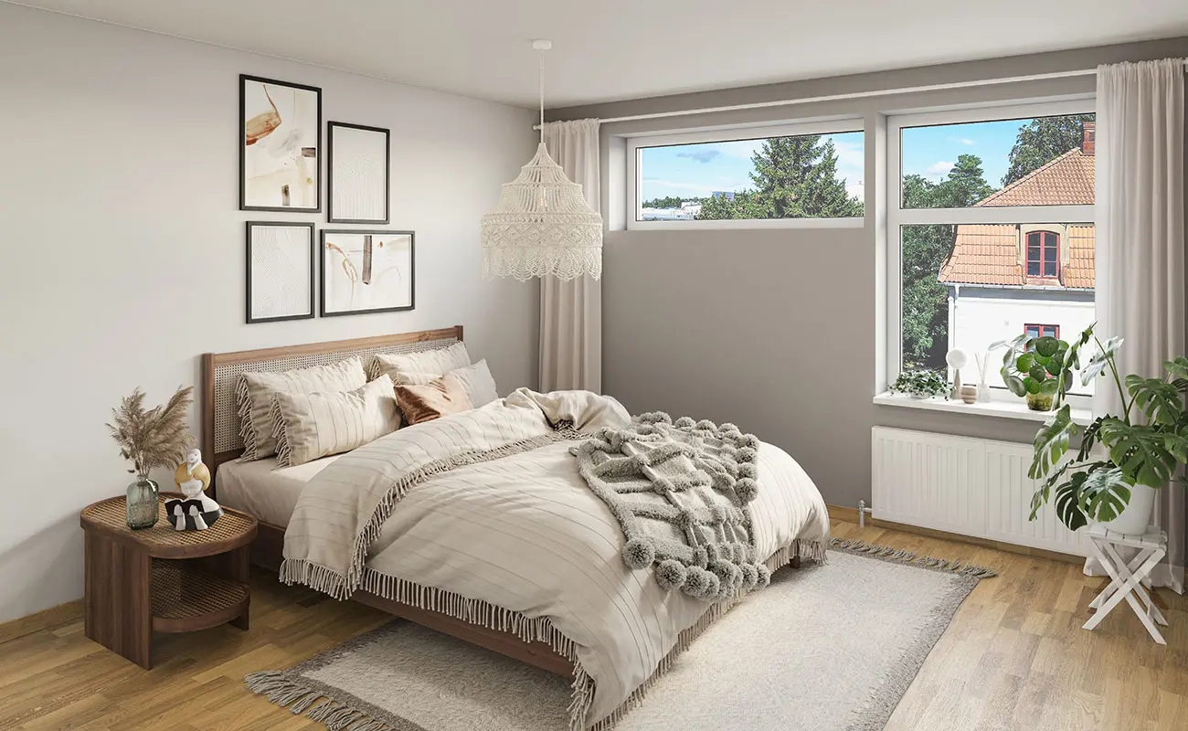 Sovrum med brunt trägolv, vita väggar och stora fönster | Nivika Fastigheter AB (publ)