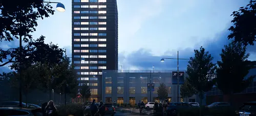 Nivika center när det är mörkt, träd i förgrunden | Nivika Fastigheter AB (publ)