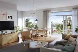 Vardagsrum med vita väggar, trägolv, en soffa och ett matsalsbord i trä | Nivika Fastigheter AB (publ)