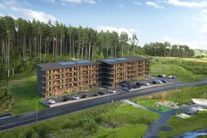 Flerbostadshus med träfasad, svart tak med solceller och skog i bakgrunden | Nivika Fastigheter AB (publ)