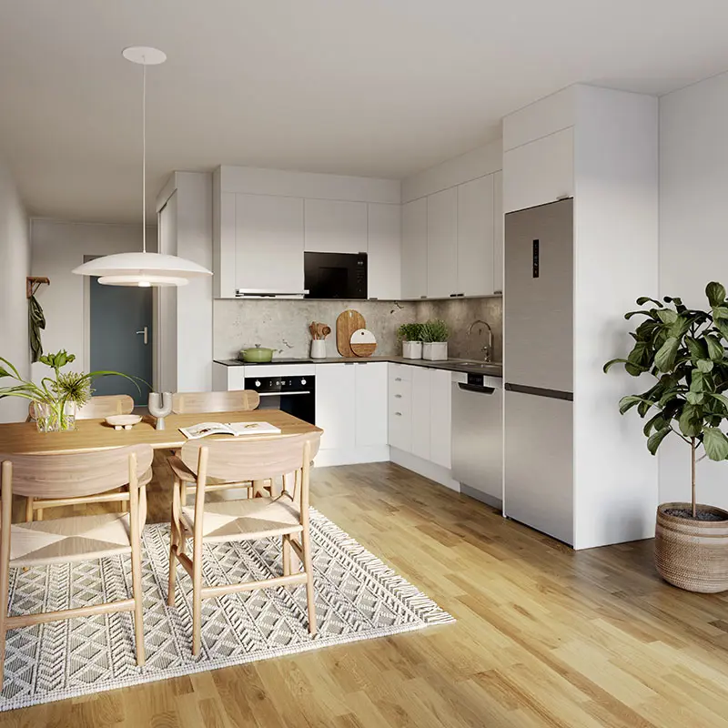 Kök med vita luckor, brunt trägolv, matsalsbord och en matta | Nivika Fastigheter AB (publ)