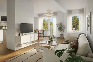 Vardagsrum med vita väggar, trägolv, en soffa och en TV | Nivika Fastigheter AB (publ)